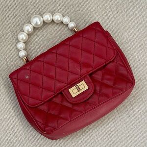 Elegant Red Quilted Handbag with Pearl Handle